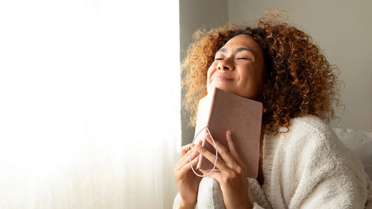 Woman with book smiling