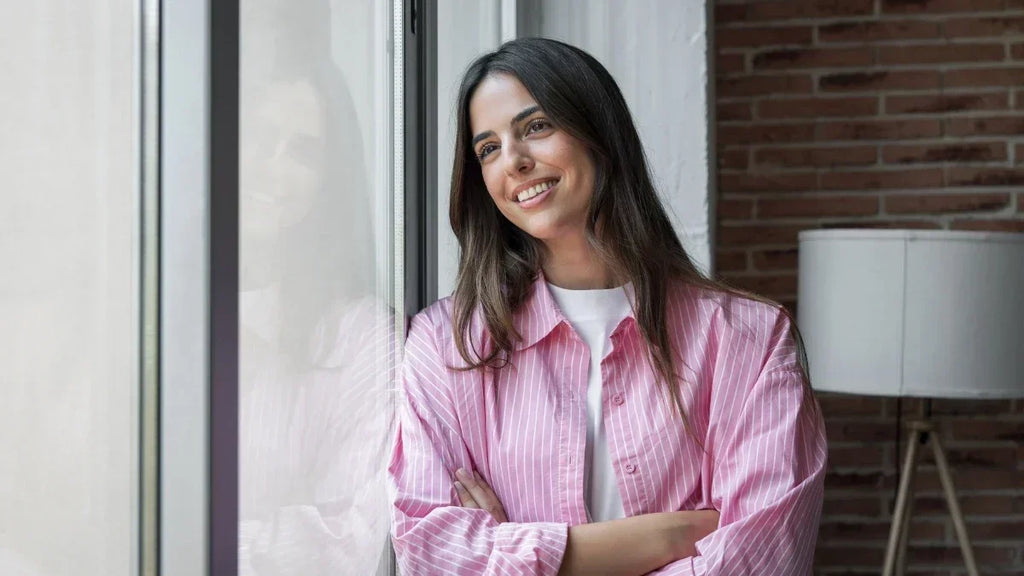 woman looking out of window smiling