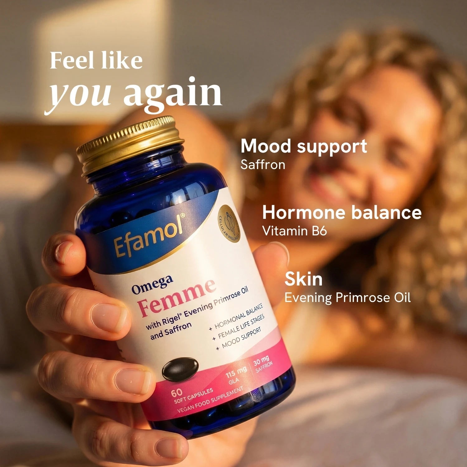 Efamol Omega Femme in woman's hand with graphic saying Feel like you again. Mood support - saffron, hormone balance - vitamin b6, skin - evening primrose oil