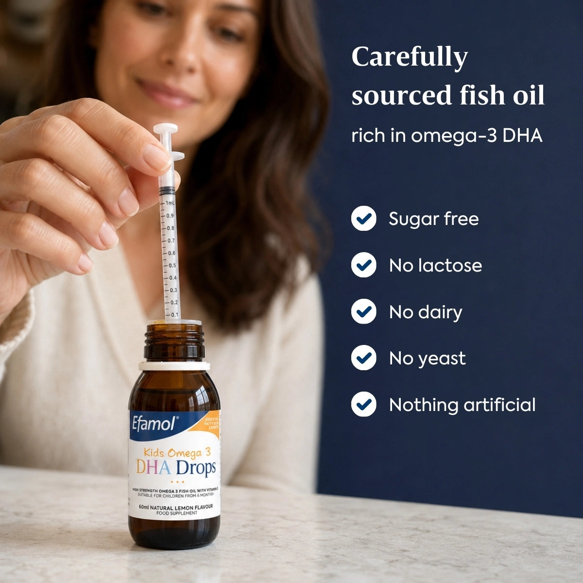 Woman holding a bottle of Efamol DHA Drops with product details on a blue background