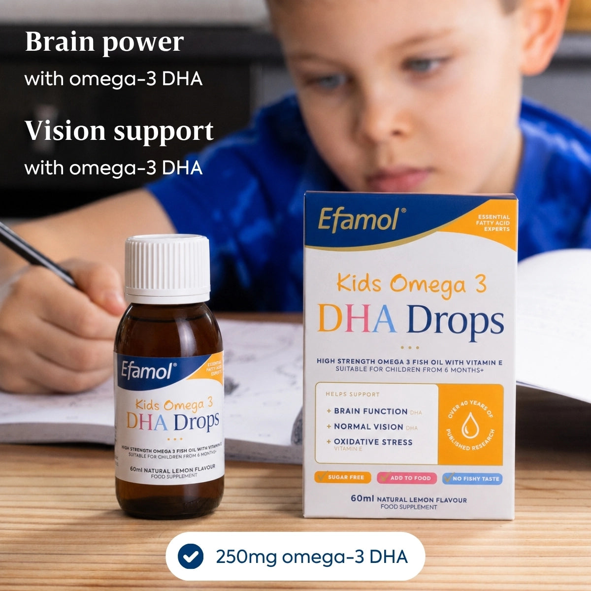 Efamol Kids Omega 3 DHA Drops bottle and packaging on a table with a child in the background.