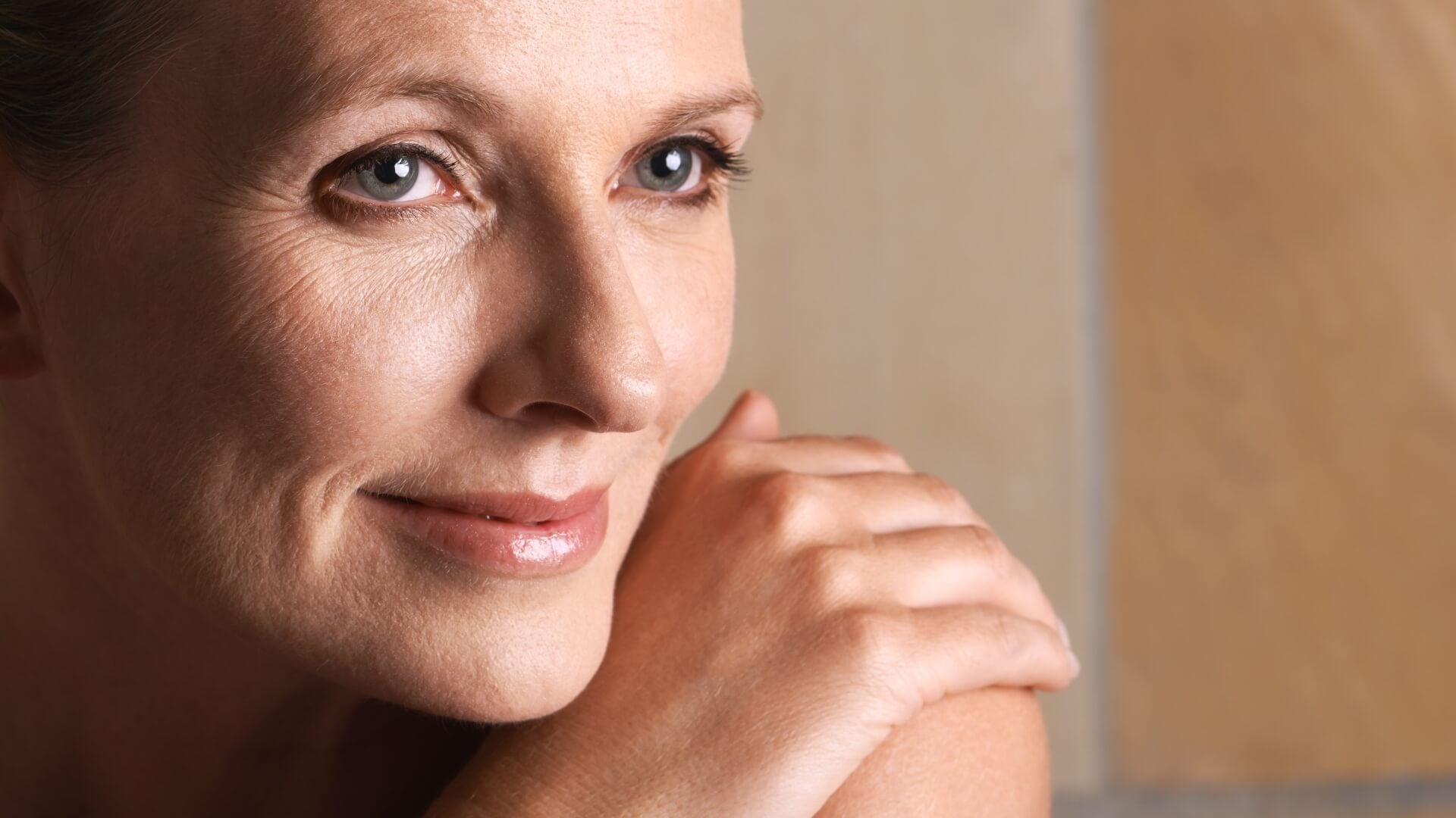 Beautiful woman with glowing soft smooth skin